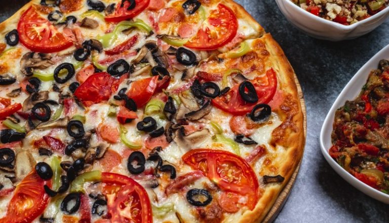 side-view-sausage-pizza-with-tomato-bell-pepper-smoked-sausage-black-olive-cheese-table (1)